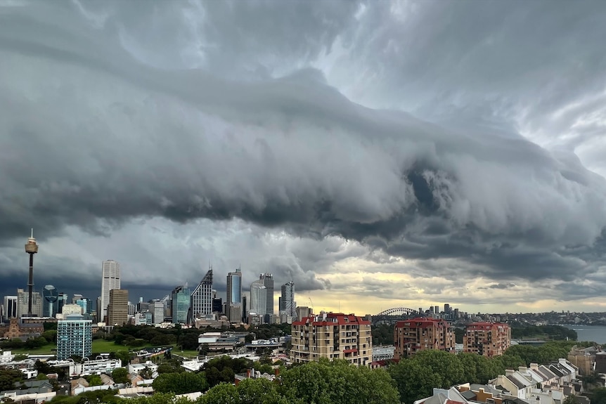 Ominous storm cloud looms over Sydney city