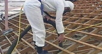 Mr Fluffy asbestos is removed from a Canberra house in the 1990s.