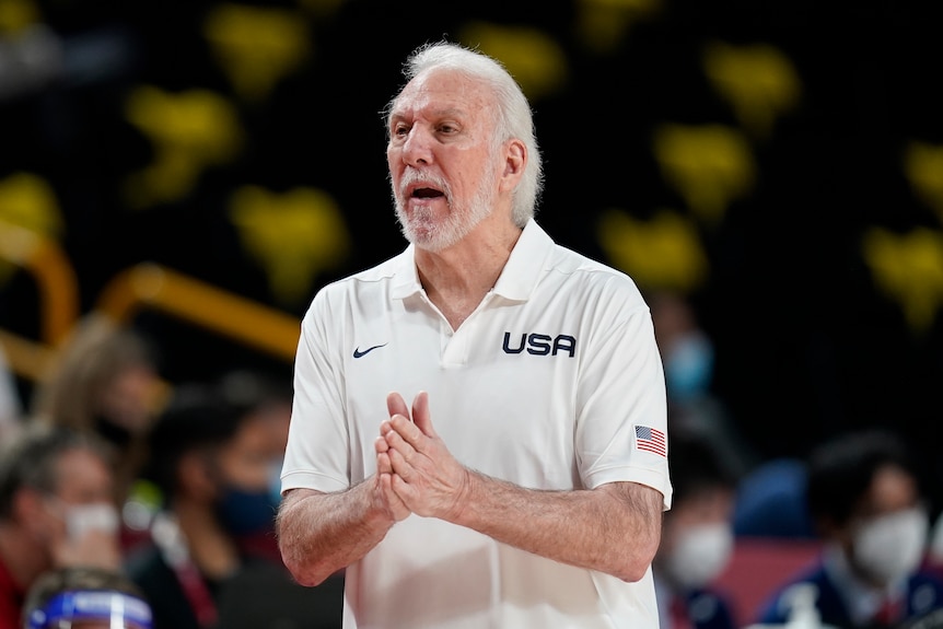 Gregg Popovich claps his hands together