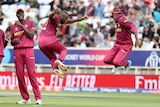 Two West Indies cricketers leap in the air to celebrate a wicket in a World Cup match.