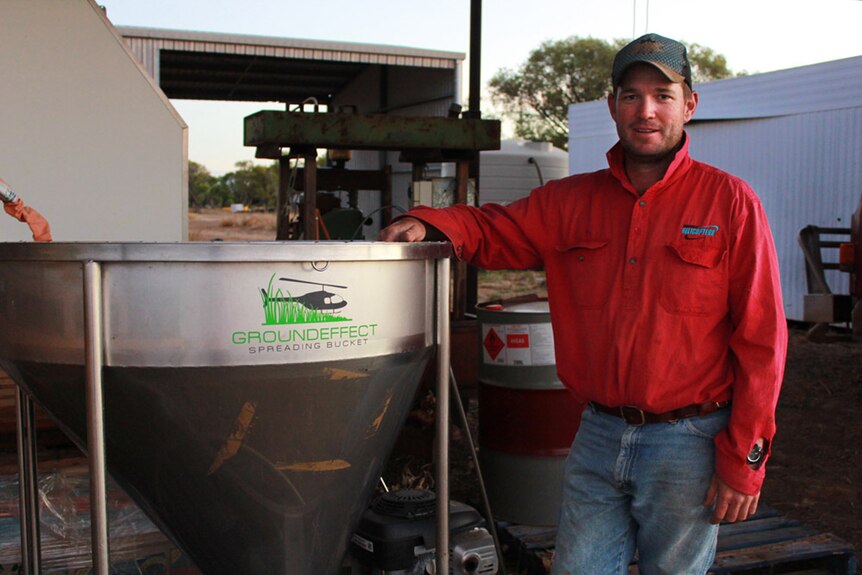 Will Seymour standing with his hopper and spreader
