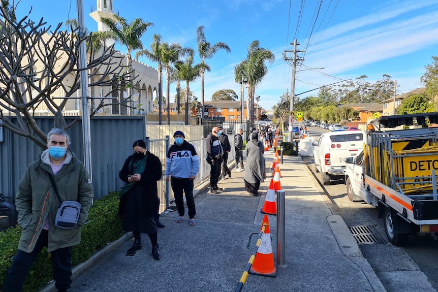 People lining up outside a mosque