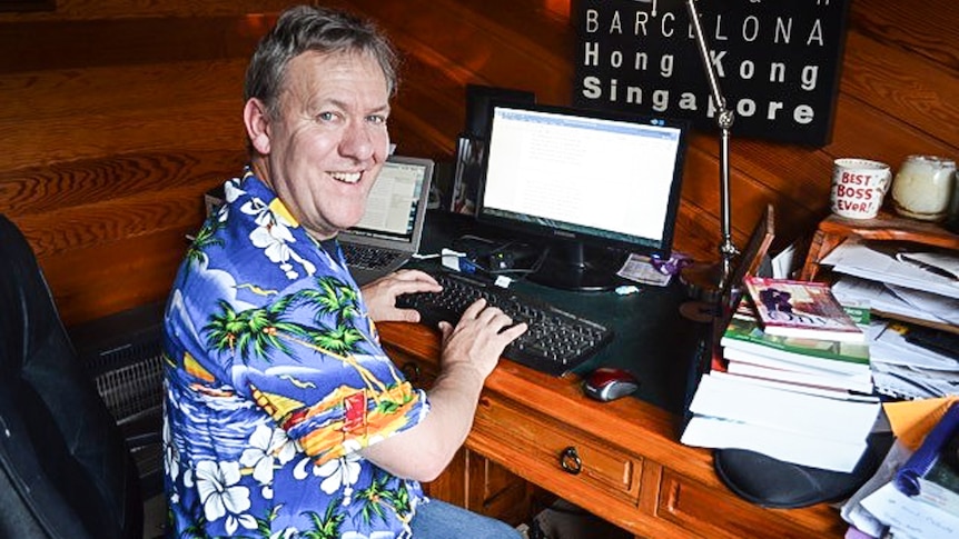 Melbourne paramedic and writer Jeff Kenneally at home sitting at his desk.