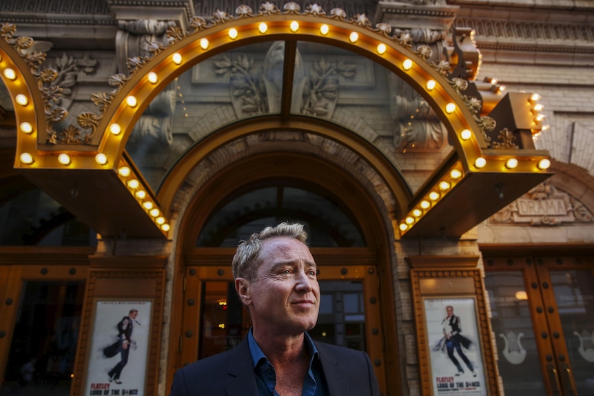 Michael Flatley standing outside the Lyric Theatre in New York in 2016 