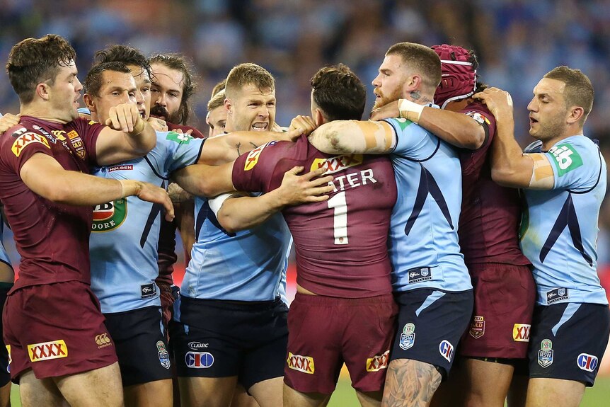 Heated exchange ... The Blues and Maroons scuffle during the opening half of Origin II