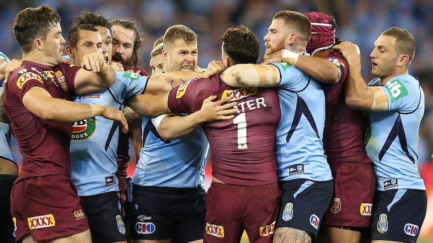 Heated exchange ... The Blues and Maroons scuffle during the opening half of Origin II
