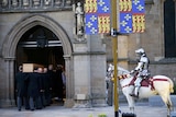 King Richard III's coffin is carried into Leicester Cathedral in Leicester in central England