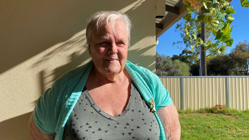 75-year-old Marjorie Patullo stands on her verandah