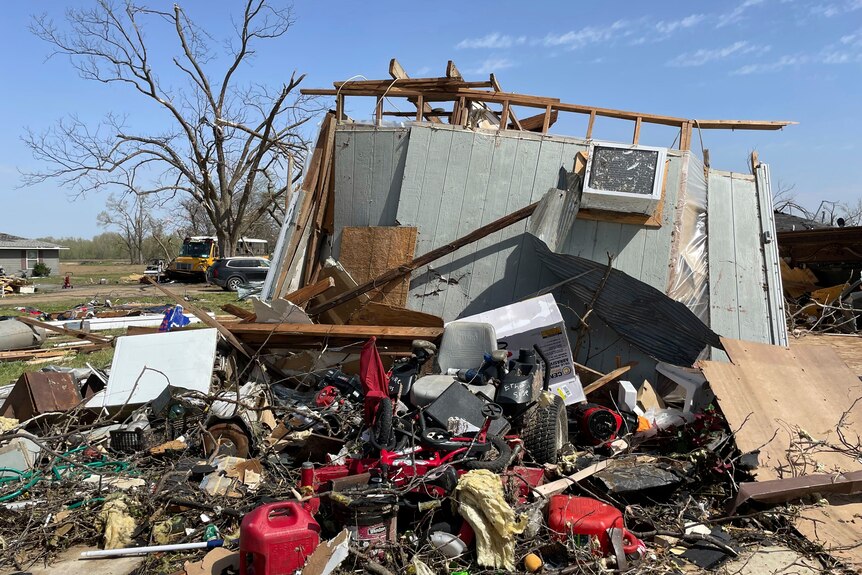 Tornado debris is scattered on the ground in Silver City, Mississippi
