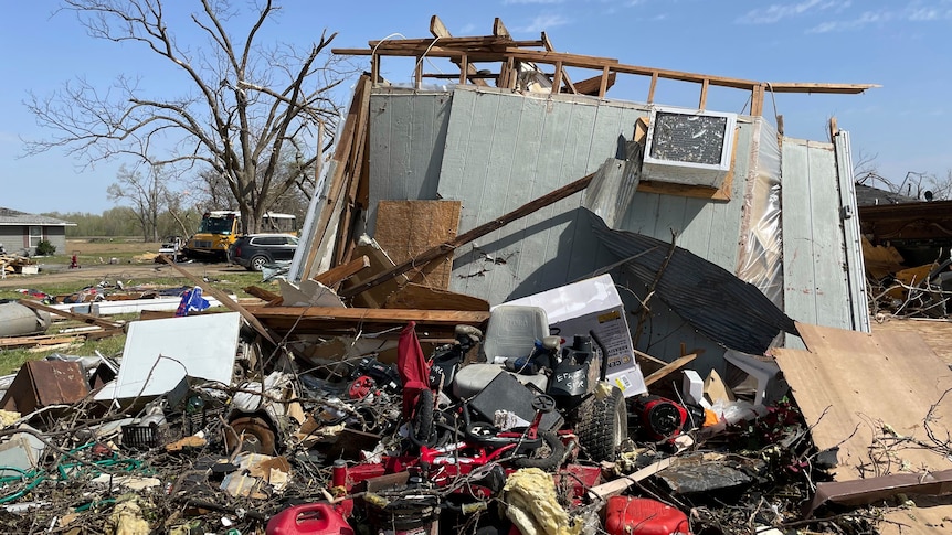 Tornado debris is scattered on the ground in Silver City, Mississippi