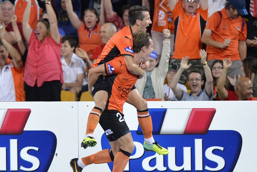 Matthew Smith and Liam Miller celebrates a goal for Brisbane Roar v Sydney FC at Lang Park.