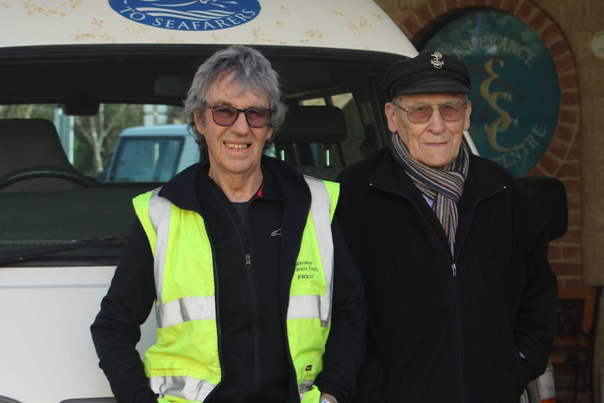 The pair stand by their van