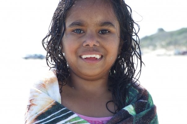 Heidi Singh wrapped in a towel at the beach