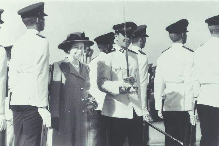 Black and white photo shows Queen Elizabeth II inspecting the guard in Canberra, 1988.