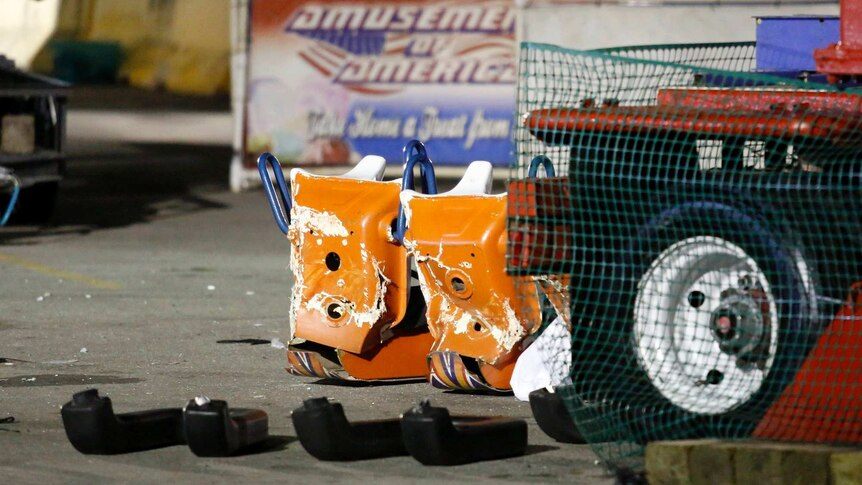 The back of orange carriage that fell of Fire Ball ride at Ohio State Fair