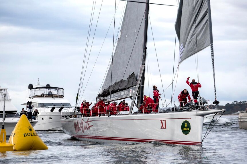 Wild Oats XI crosses the finish line to win the 2012 Sydney to Hobart yacht race.