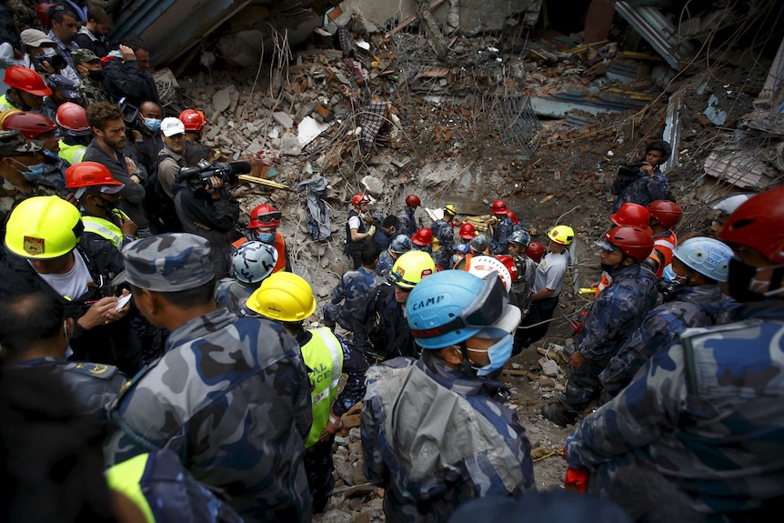 Rescuers search for teen trapped rubble