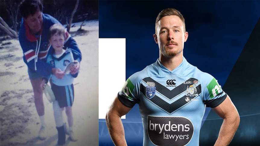 Damien Cook dressed in NSW Blues jersey and shorts holding a fishing reel.