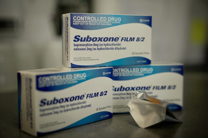 Three blue boxes of Suboxone Film and an open pack showing the medication