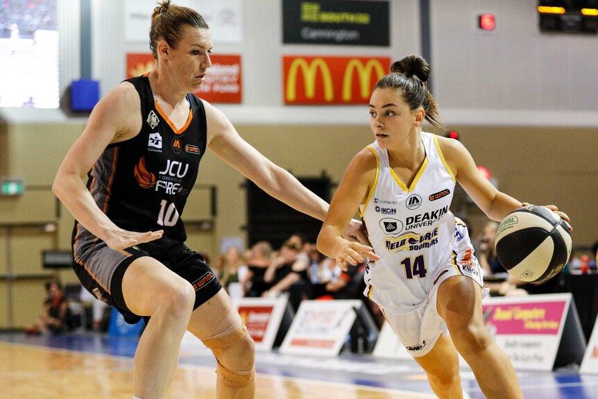 Monique Conti of the Melbourne Boomers drives the ball during the Womens NBL game between Townsville Fire and Melbourne Boomers.