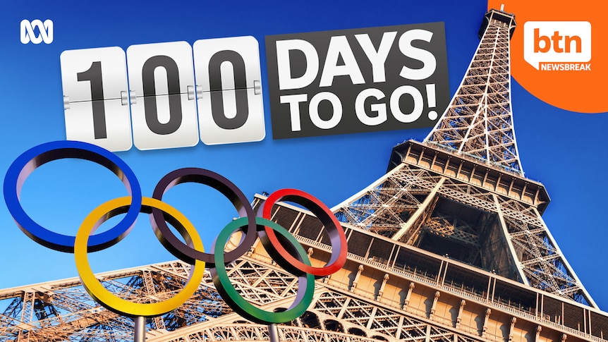 The Olympic rings in front of the Eiffel Tower with the words 100 days to go. 