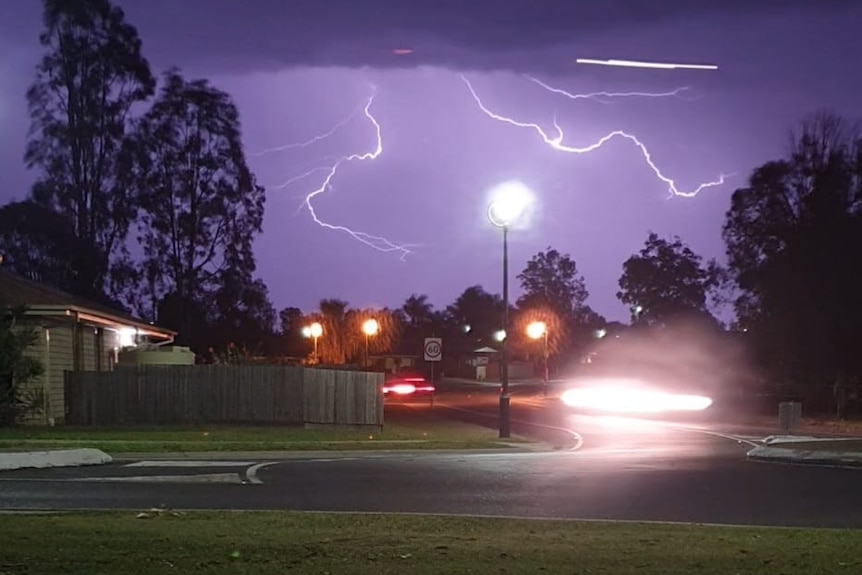 Lightning over homes.