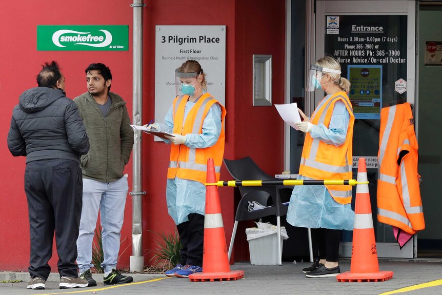 Patients are screened before entering a medical center in central Christchurch, New Zealand.