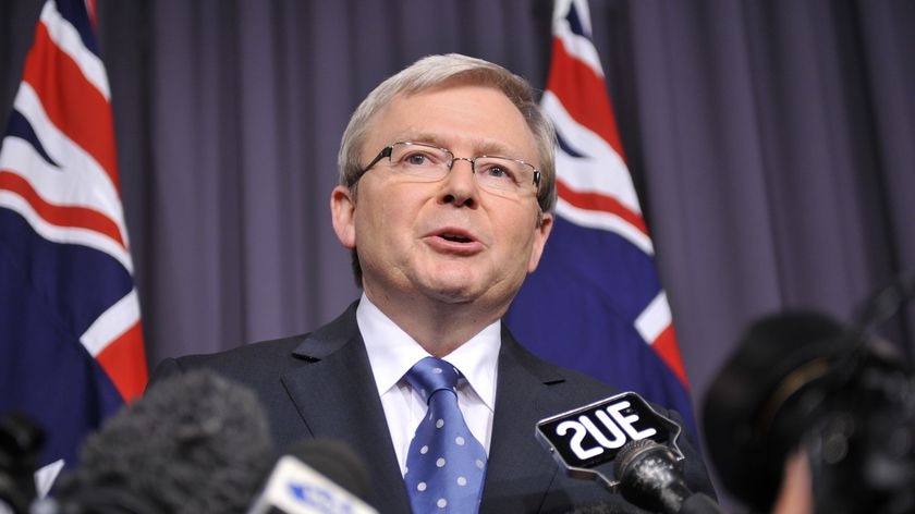 Prime Minister Kevin Rudd addresses a packed press conference in Canberra