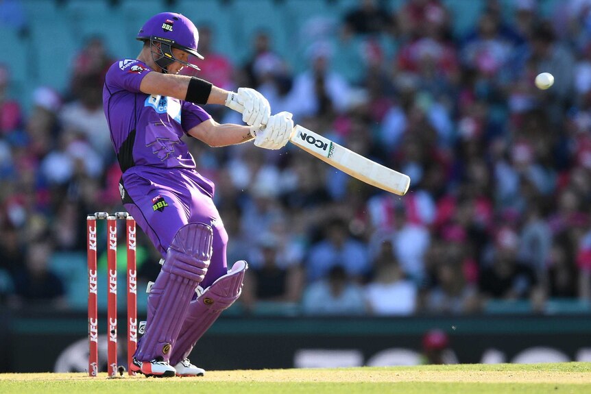 D'Arcy Short of the Hobart Hurricanes hits the ball in cricket.