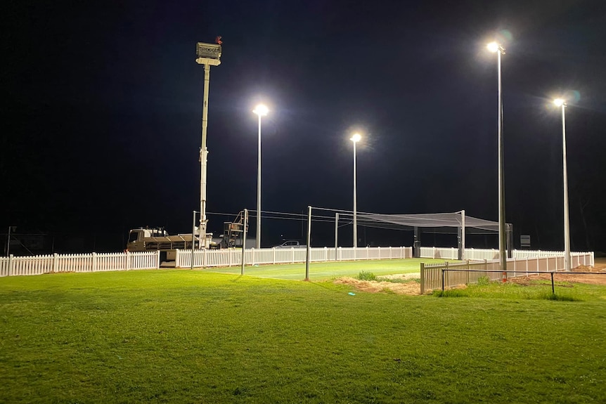 A floodlit sporting field.