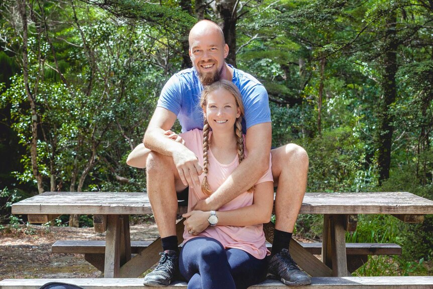 Rachel and Chris Bragg sitting on a picnic table