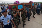 Bodies of AirAsia crash victims begin to arrive in Indonesia