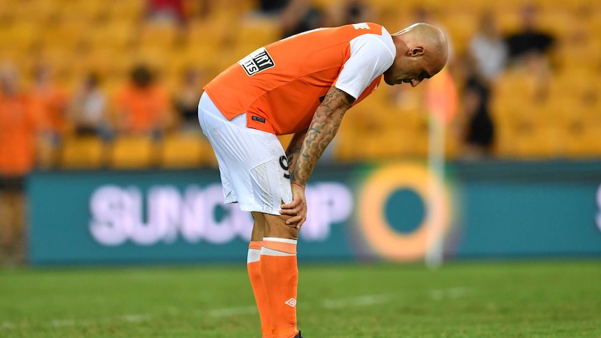 Massimo Maccarone with his hands on his knees.