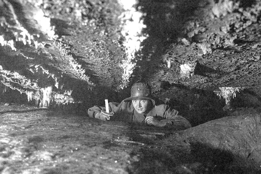 Early caver Lucy King holds a candle. ONE USE ONLY