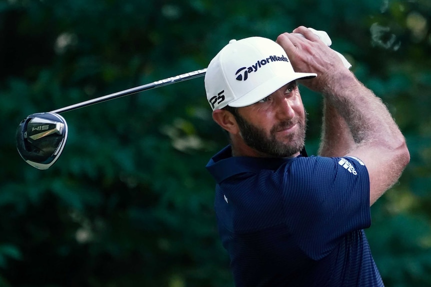 A golfer stares down the fair way after completing his tee shot at a PGA Tour event.