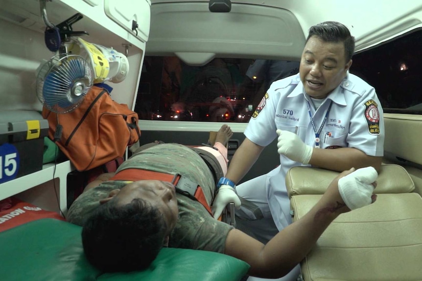 Thai paramedic Phuttikornnan Wongsumalee speaks to patient