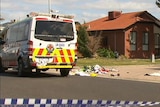 An ambulance behind police tape in Keilor Downs.