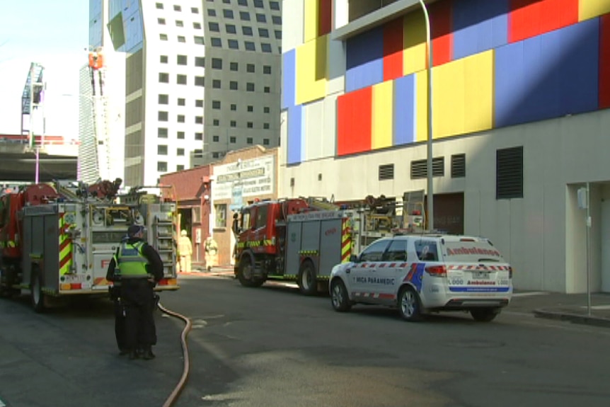 Emergency services on the scene after a man suffered burns and two others arrested at Southbank.