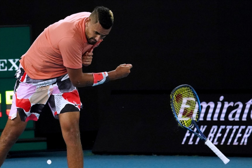 Nick Kyrgios throws his racquet to the floor and smashes it