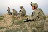 US Army soldiers move into position