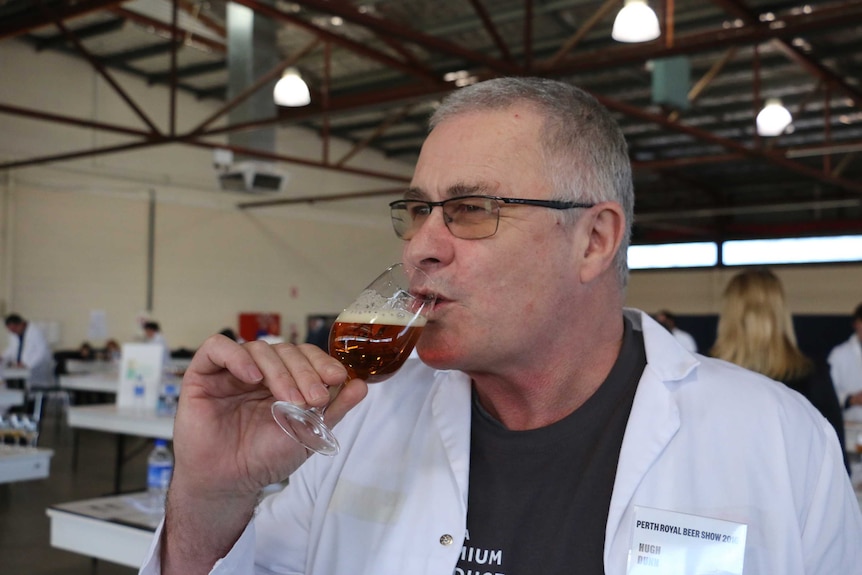 Chief judge Hugh Dunn tastes an Indian pale ale
