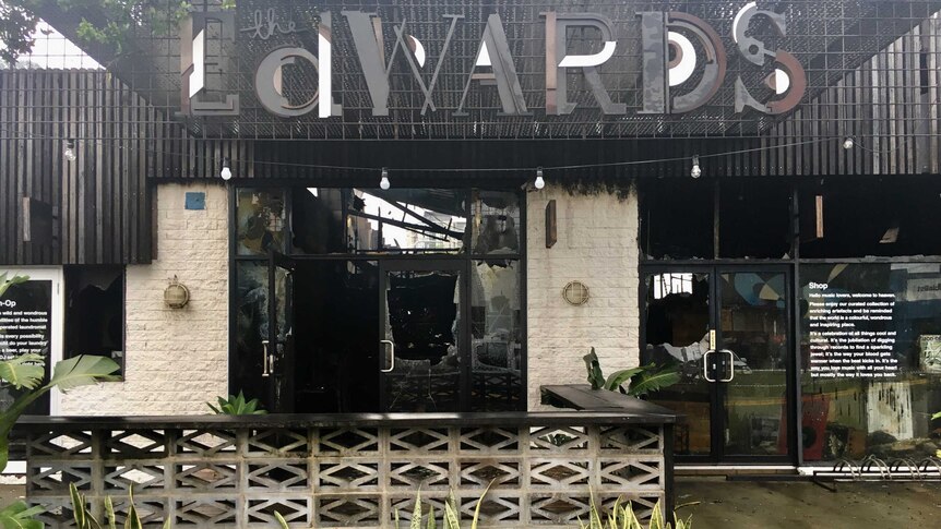 The entrance to The Edwards bar in Newcastle West, blackened by fire with smashed windows.