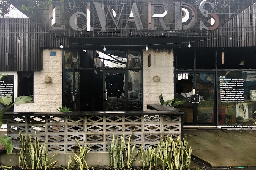 The entrance to The Edwards bar in Newcastle West, blackened by fire with smashed windows.