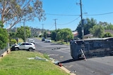 Overturned bus and car crashed into a fence in Cowra