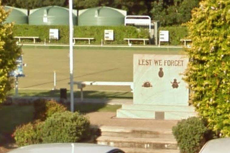 The stone war memorial between the car park and the bowling green at Black Head Bowling Club.