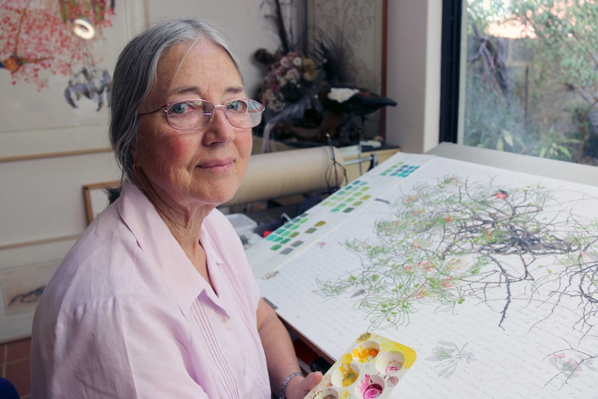 Botanical artist Philippa Nikulinsky with one of her works.