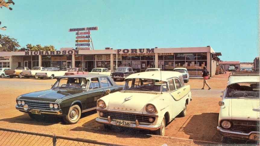 Vintage cars outside a shopping centre in Port Hedland with blue skies