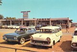 Vintage cars outside a shopping centre in Port Hedland with blue skies