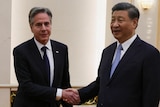 US Secretary of State Antony Blinken shakes hands with Chinese President Xi Jinping