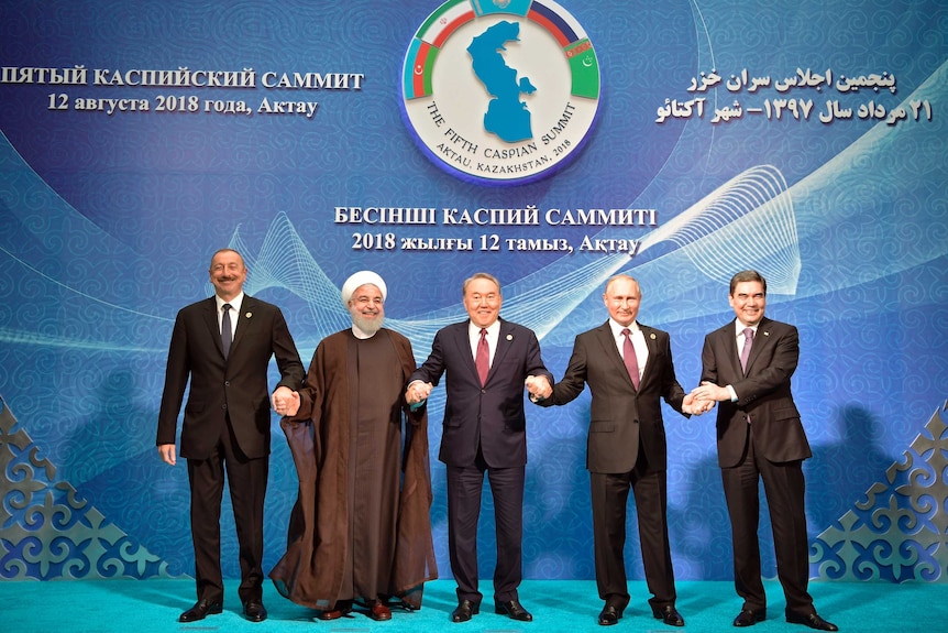 Vladimir Putin, Nursultan Nazarbayev, Gurbanguly Berdimuhamedow, Ilham Aliyev and Hassan Rouhani stand in a row.